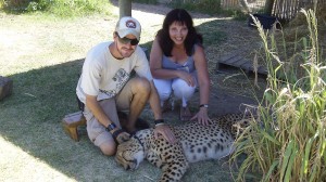 Sandy Robins Petting a cheetah in Stellenbosch, South Africa