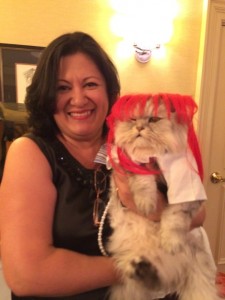 Ada Nieves and her cat Martini dressed from Hairspray